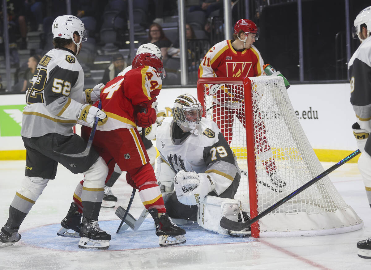 Silver Knights goaltender Carter Hart (79) defends the net during the second period of an AHL h ...