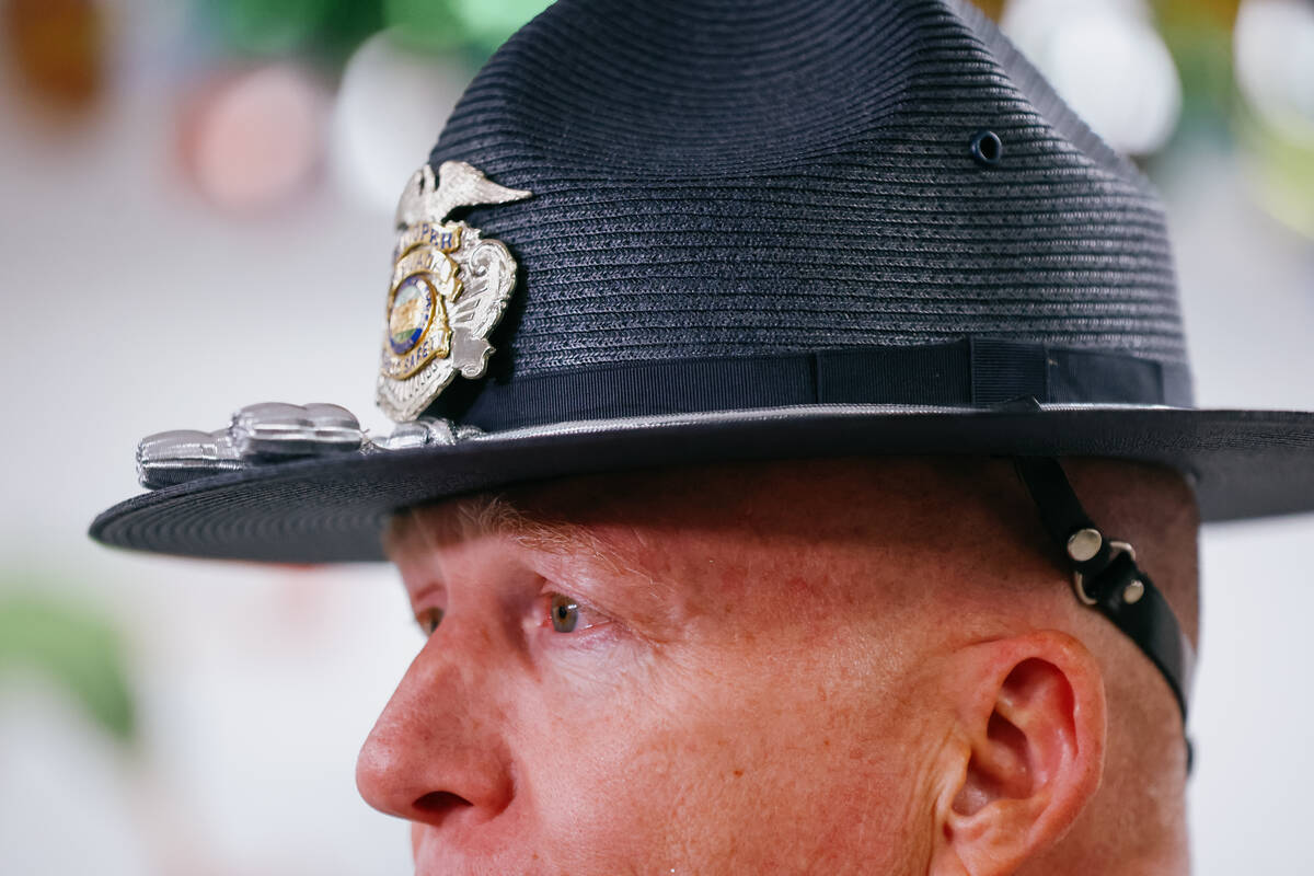 Nevada Highway Patrol Public Information Officer Shawn Haggstrom speaks with journalists during ...