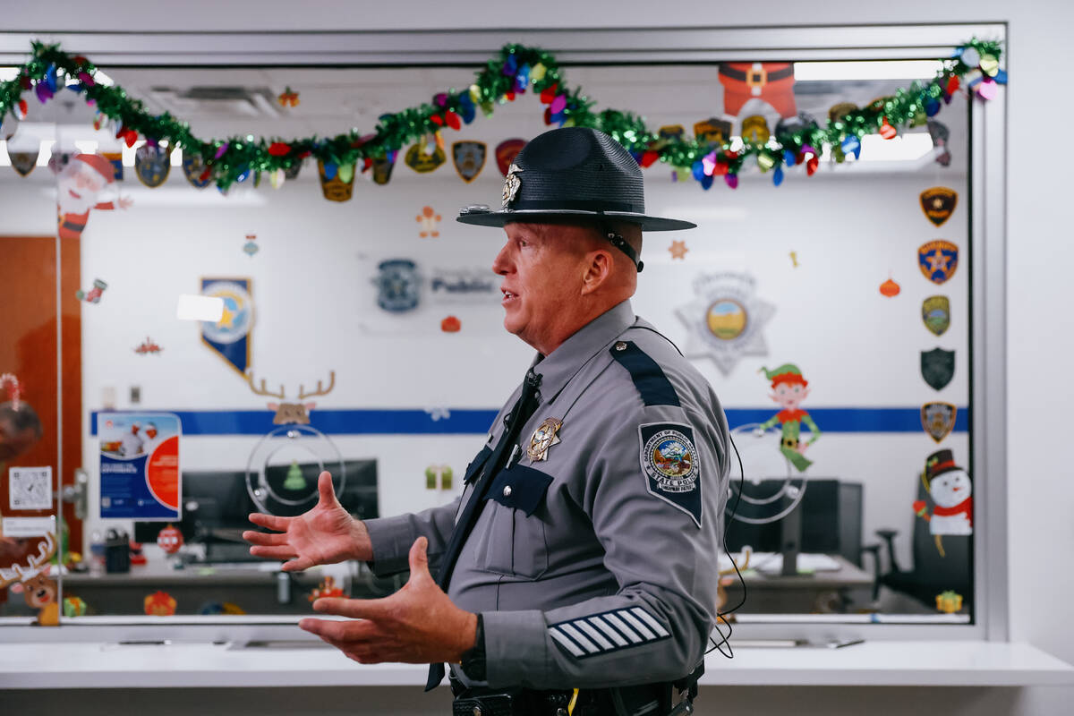 Nevada Highway Patrol Public Information Officer Shawn Haggstrom speaks with journalists during ...