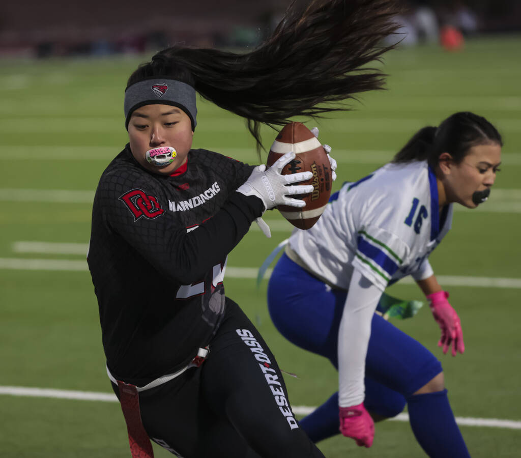 Desert Oasis' Akiko Higa (29) runs the ball against Green Valley during a flag football ga ...