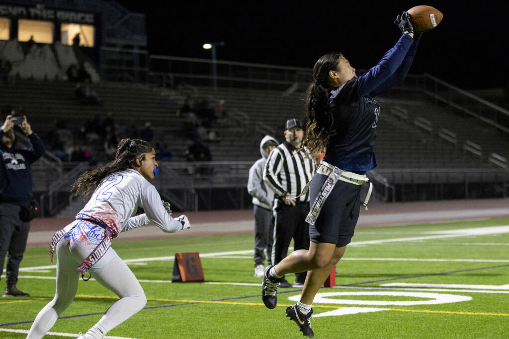 Shadow Ridge junior Jaylani Palmer (12) catches a pass in the end zone during the high school f ...