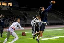 Shadow Ridge junior Jaylani Palmer (12) catches a pass in the end zone during the high school f ...
