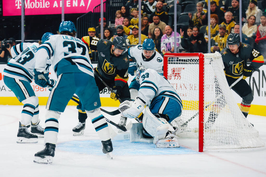 Golden Knights center Tomas Hertl (48) fights for a goal during an NHL hockey game between the ...
