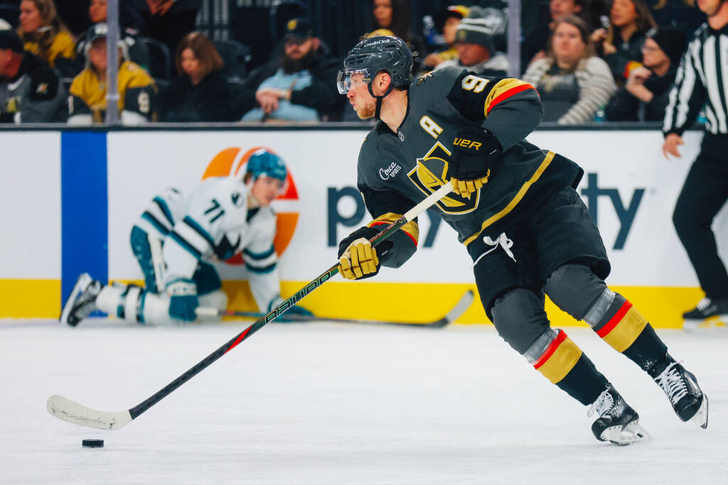 Golden Knights center Jack Eichel (9) skates the puck back across the ice during an NHL hockey ...