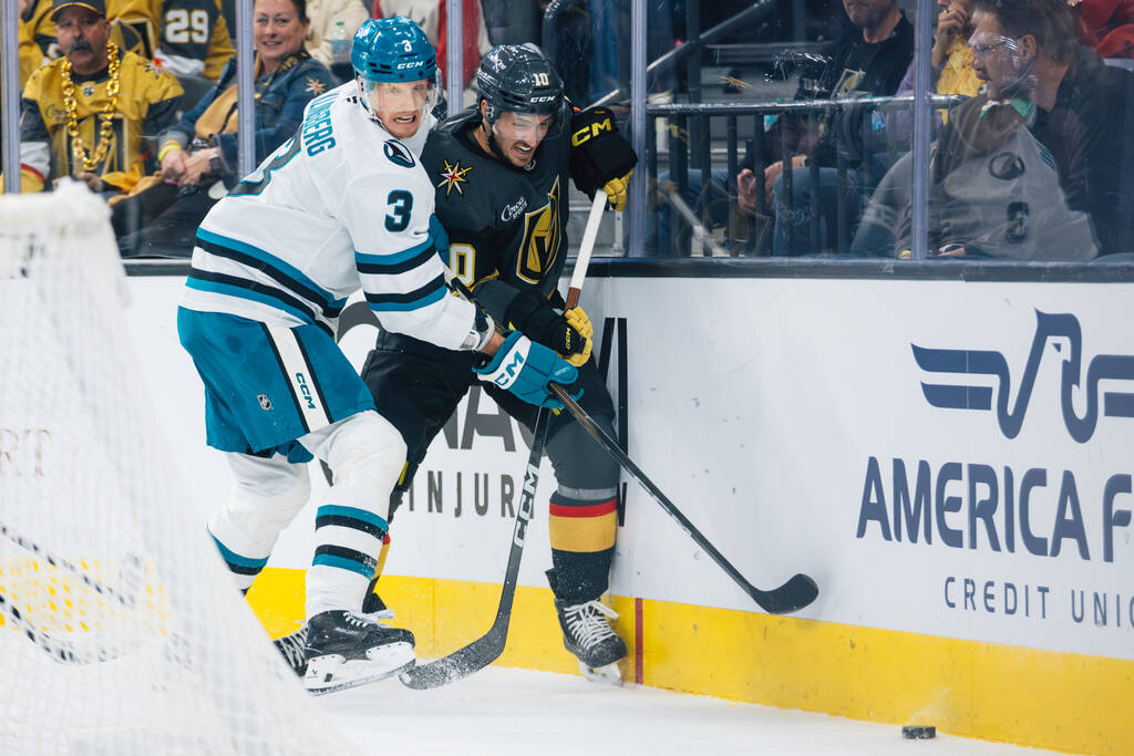 San Jose Sharks defenseman John Klingberg (3) and Golden Knights center Colton Sissons (10) try ...