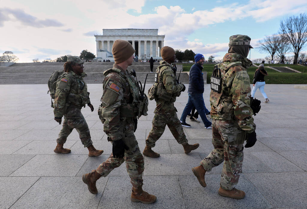 National Guard patrol the National Mall near the Lincoln Memorial, Friday, Nov. 28, 2025, in Wa ...
