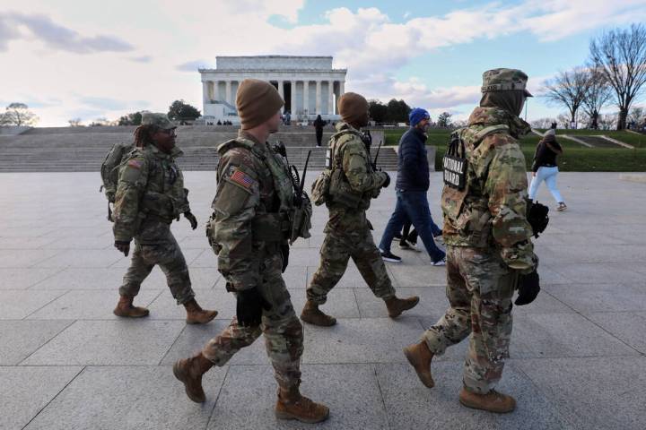 National Guard patrol the National Mall near the Lincoln Memorial, Friday, Nov. 28, 2025, in Wa ...