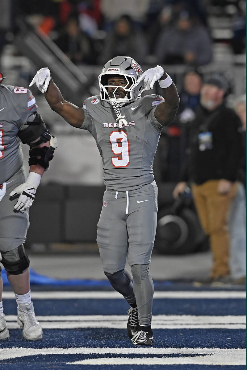 UNLV's Jai'Den Thomas celebrates a touchdown against Nevada in the first half of Saturday's gam ...