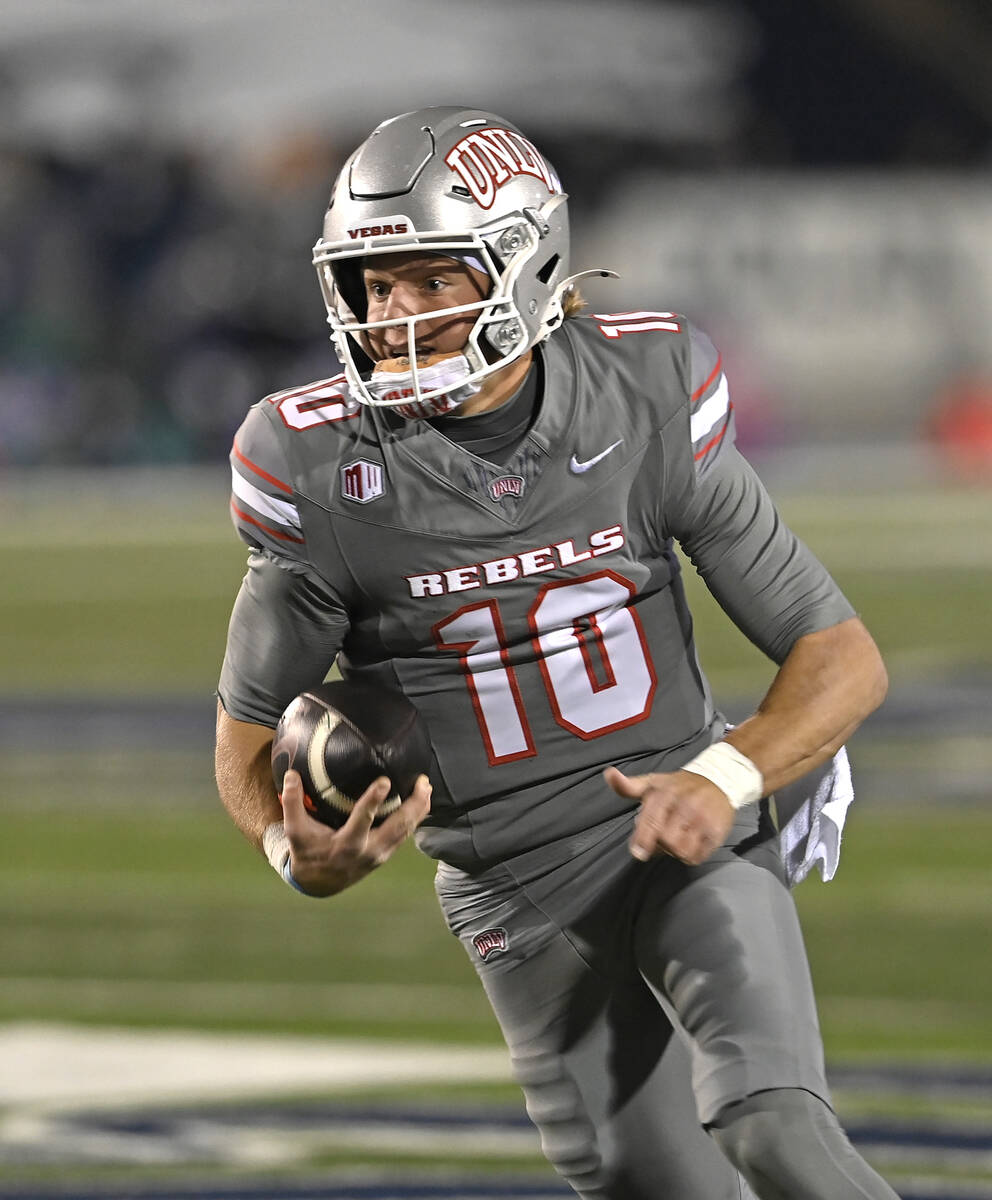 UNLV's Anthony Colandrea runs for a touchdown against Nevada during the first half of Saturday' ...