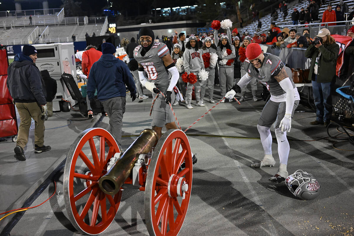 UNLV players get ready to roll the Fremont Cannon onto the field at Mackay Stadium after beatin ...