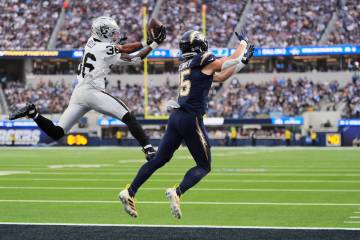 Las Vegas Raiders cornerback Kyu Blu Kelly (36) intercepts a pass intended for Los Angeles Char ...