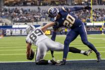 Raiders tight end Brock Bowers (89) makes a one-handed catch in the end zone over Los Angeles C ...