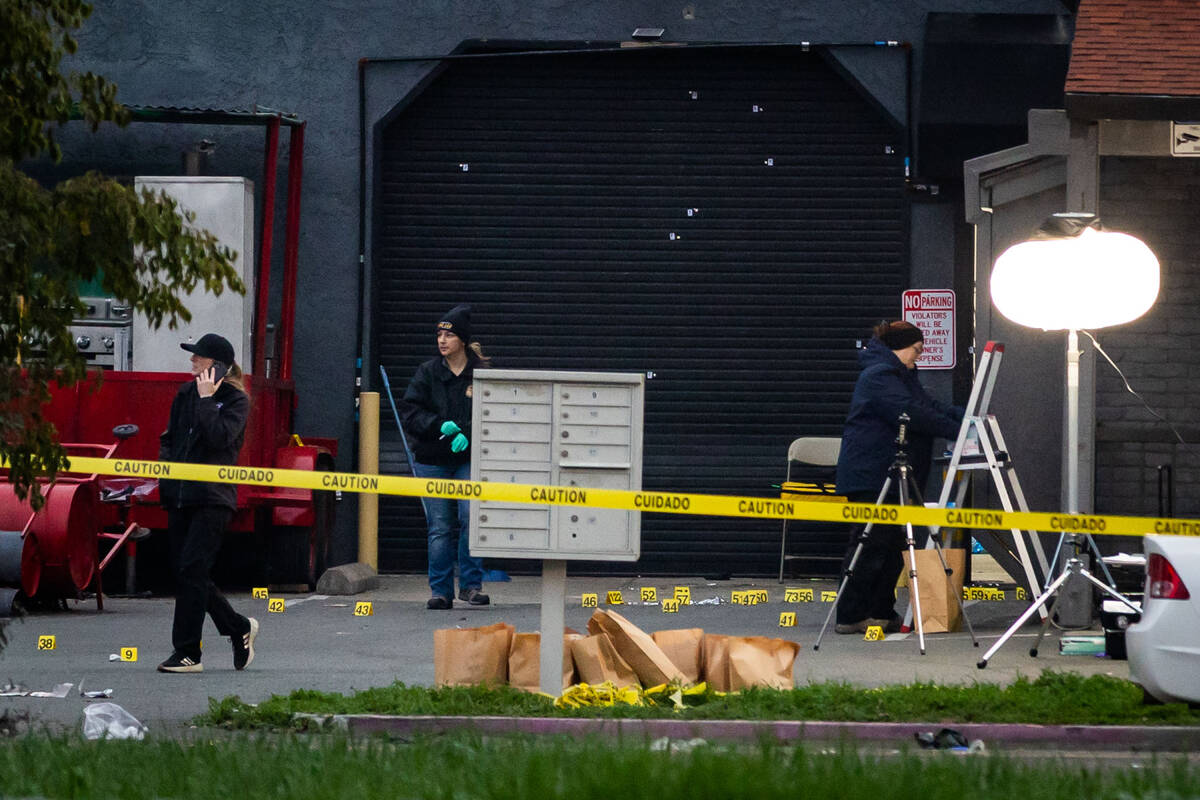Investigators examine the scene of a mass shooting Sunday, Nov. 30, 2025, in Stockton, Calif. ( ...