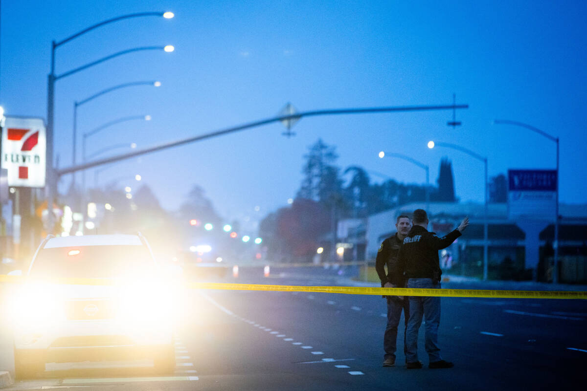 Sheriff deputies stand near the scene of a mass shooting Sunday, Nov. 30, 2025, in Stockton, Ca ...