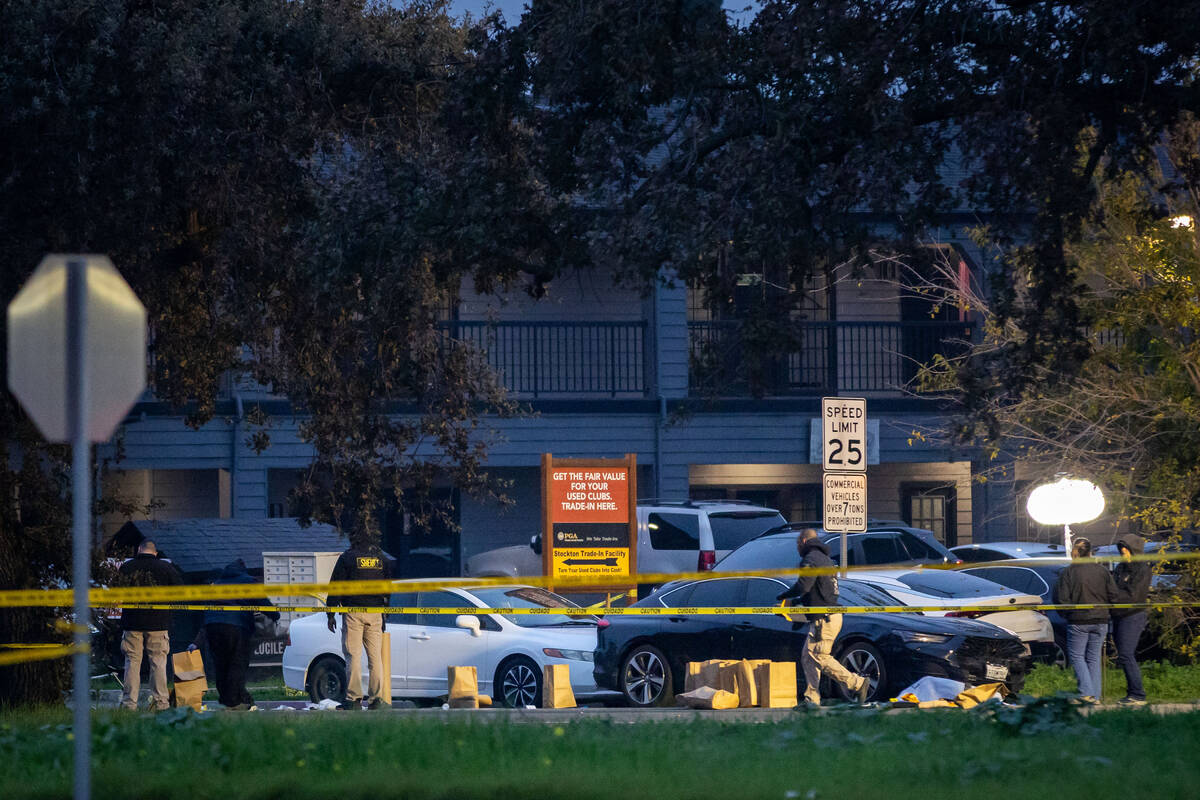 Investigators examine the scene of a mass shooting Sunday, Nov. 30, 2025, in Stockton, Calif. ( ...