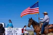 Tribal member Kess Hinkey leads the procession of a parade celebrating the Fort McDermitt India ...