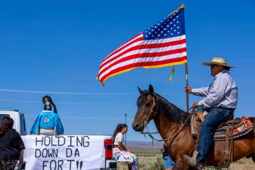 Tribal member Kess Hinkey leads the procession of a parade celebrating the Fort McDermitt India ...