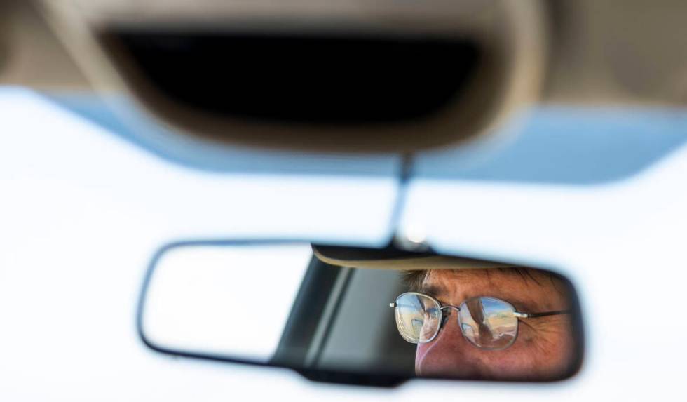 Rancher Ed Bartell drives his range land inspecting water holes to ensure the water table has n ...