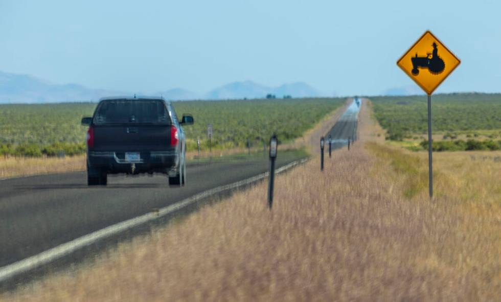 One of the warning signs for drivers reminding them of farming activities below the Thacker Pas ...