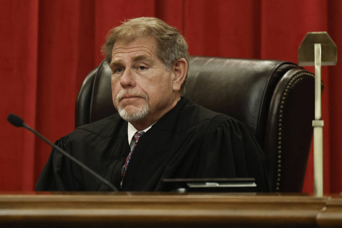Justice Ron D. Parraguirre hears oral arguments at the Nevada Supreme Court Wednesday, Dec. 3, ...