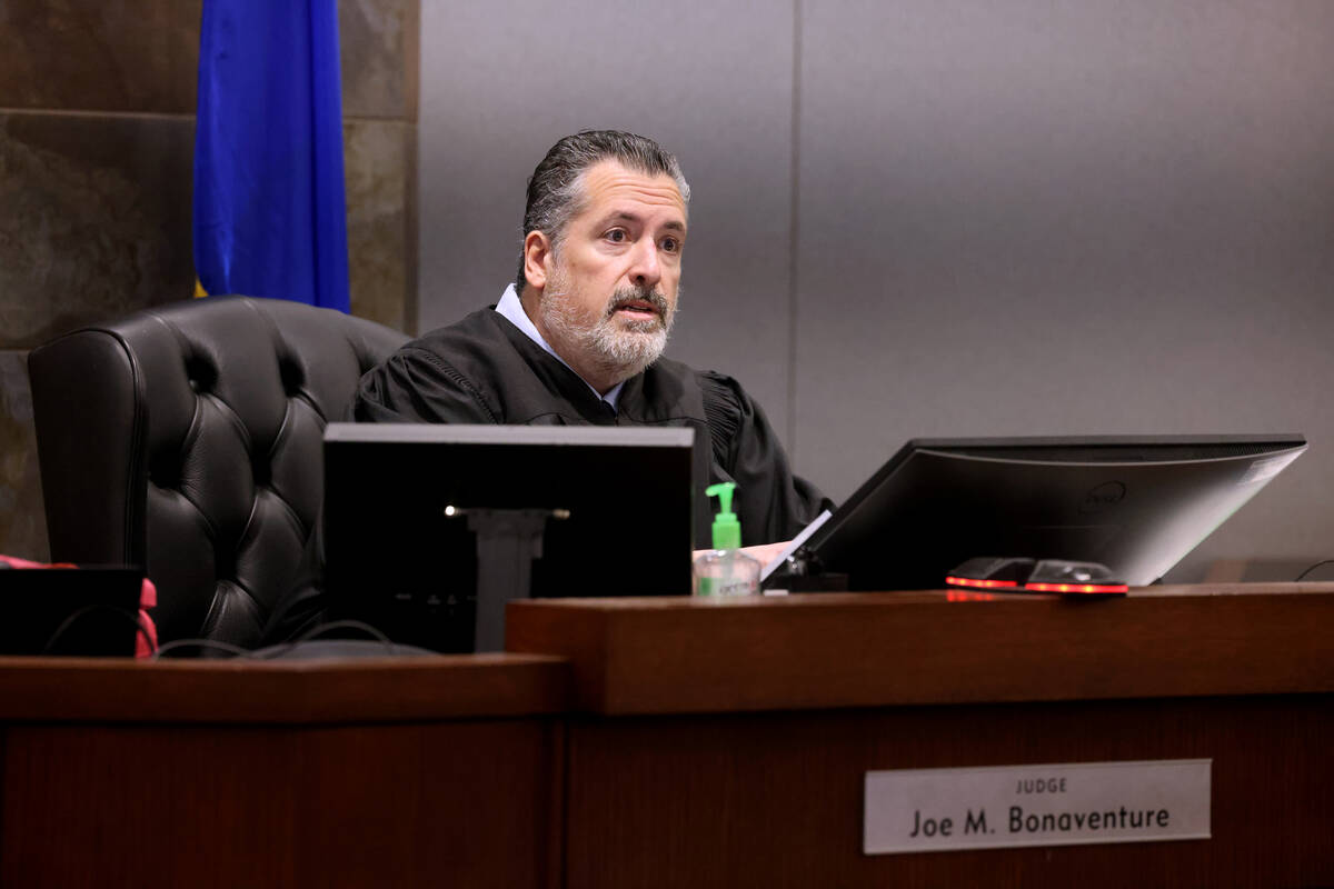 Las Vegas Justice of the Peace Joe Bonaventure talks with attorneys during a hearing at the Reg ...