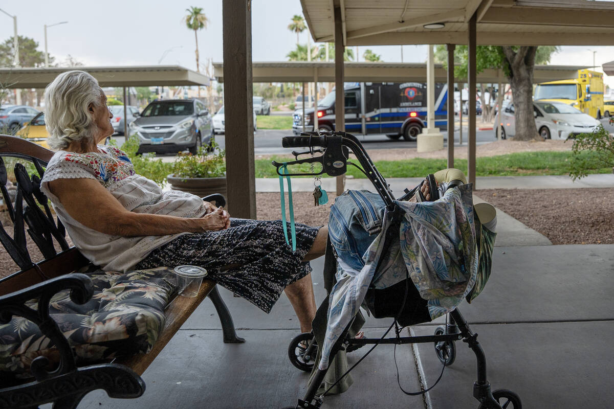 Olga DeLeon, 89, waits for her son to pick her up from Holiday Montara Meadows senior living ap ...
