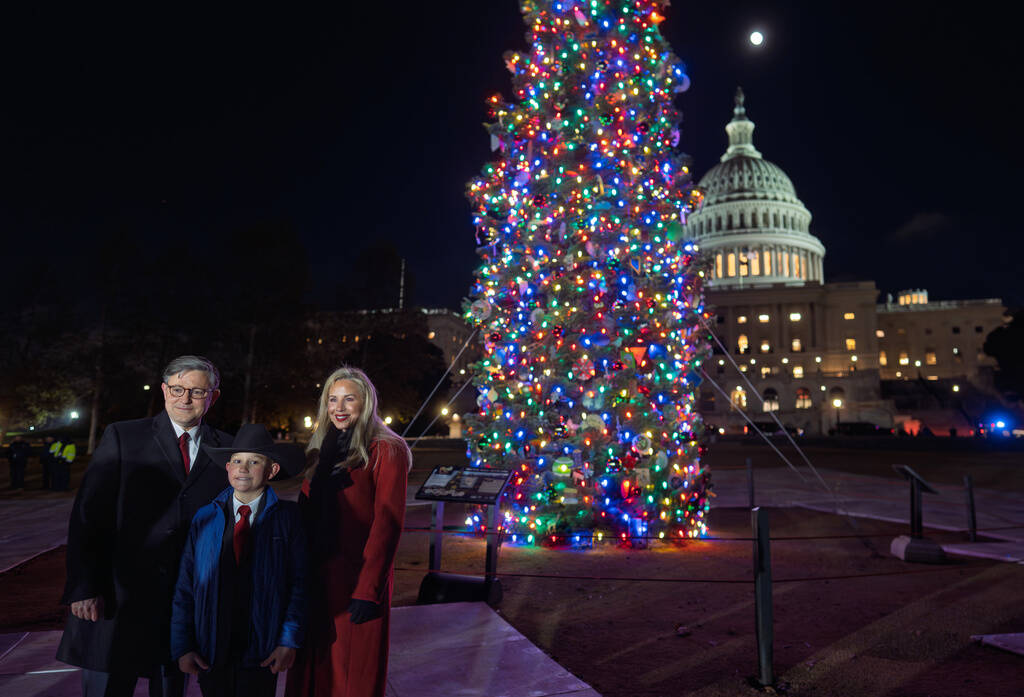 House Speaker Mike Johnson of La., and his wife Kelly Johnson stand with Grady Armstrong, a fou ...