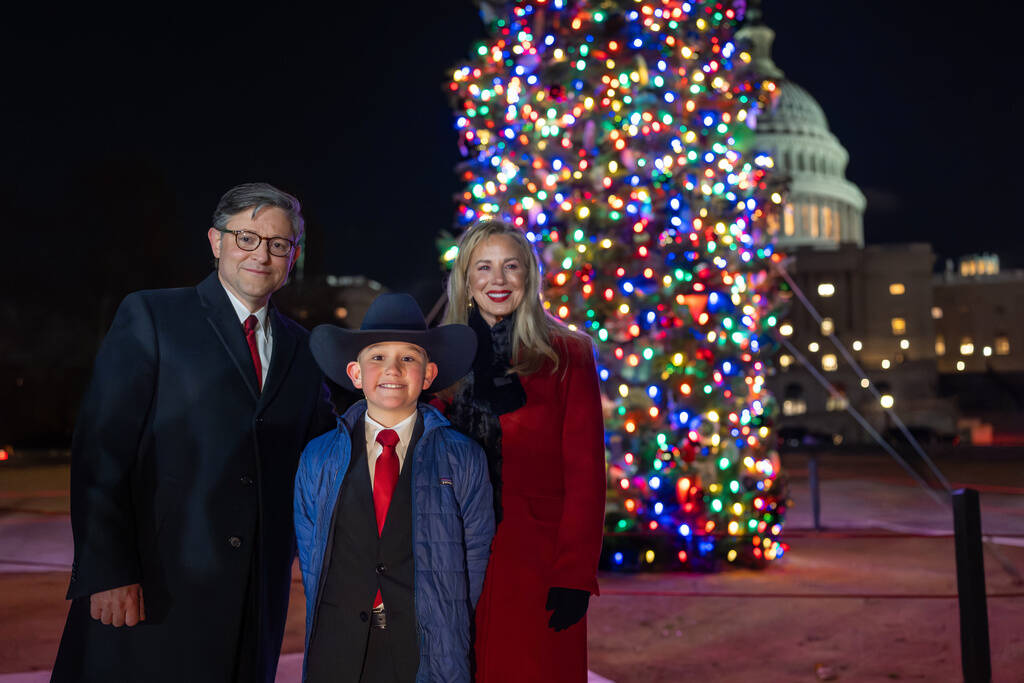 House Speaker Mike Johnson of La., and his wife Kelly Johnson, stand with Grady Armstrong, a fo ...