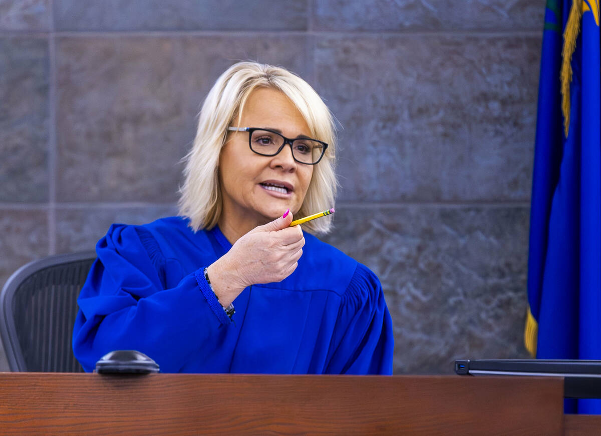 Justice of the Peace Amy Chelini presides over a hearing at the Regional Justice Center on July ...