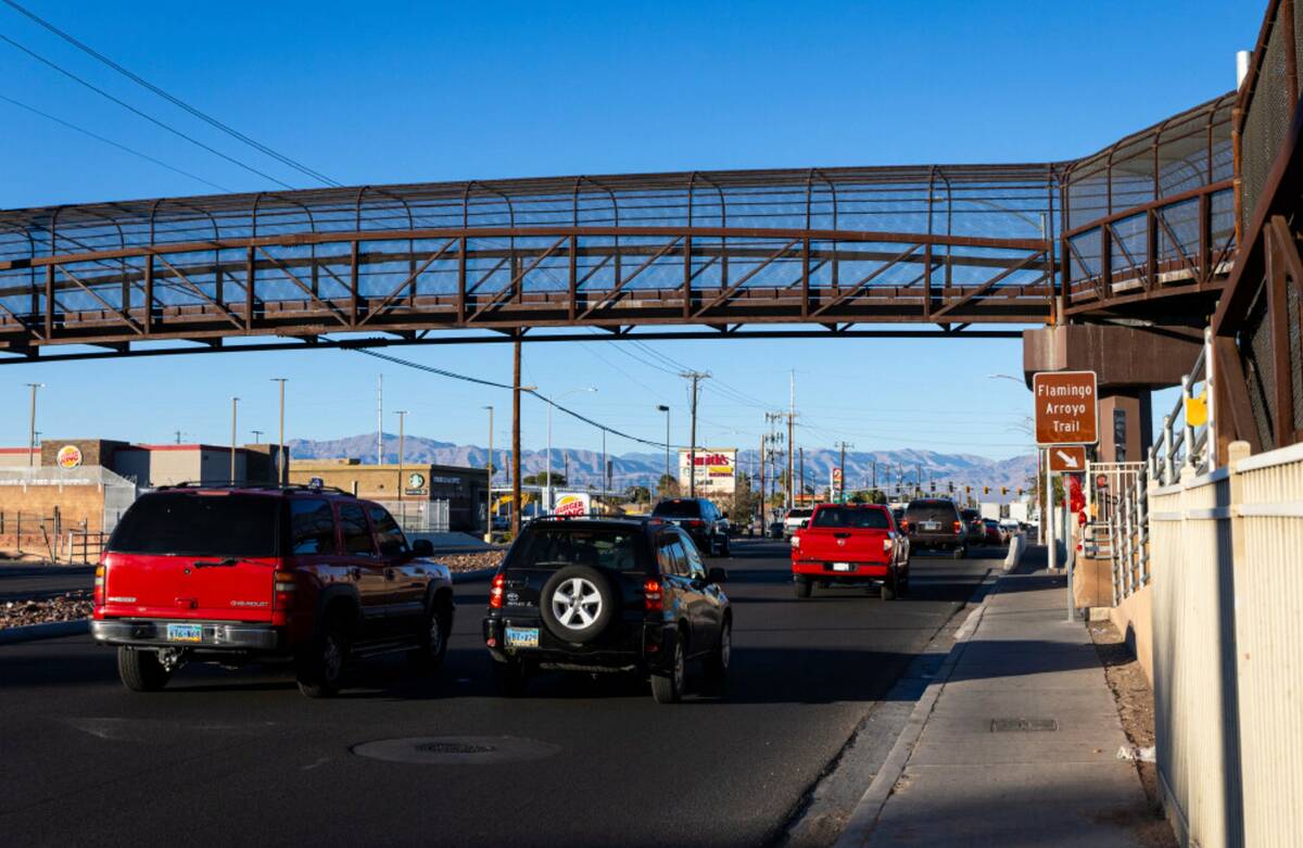 A closed overhead pedestrian bridge is seen near a memorial for Jon Silk, a pedestrian who was ...