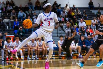 Bishop Gorman guard Ty Johnson (3) saves a long pass as during the second half of their 5A boys ...