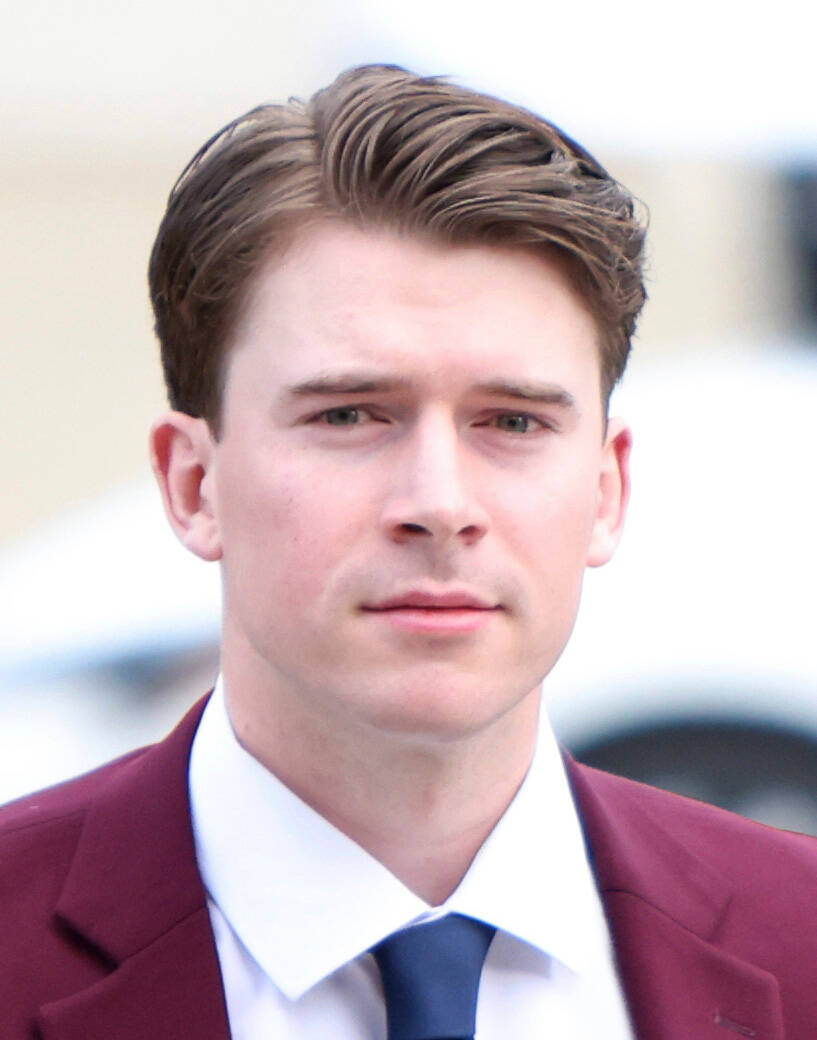 FILE - Hockey player Carter Hart, right, arrives at the London Courthouse in London, Ontario, T ...