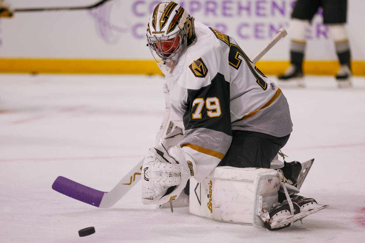 Goaltender Carter Hart warms up before the Silver Knights’ game against the Calgary Wran ...