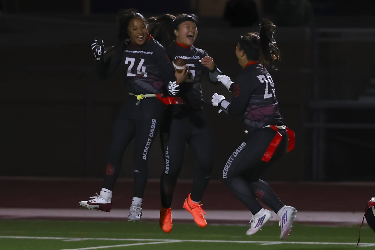 Desert Oasis' Akemi Higa (5) celebrates her touchdown with Aleia Santos (24) and' Akiko Higa (2 ...