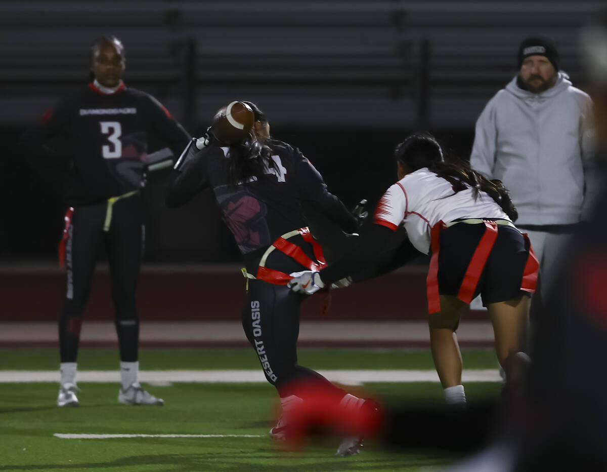 Las Vegas’ Lissette Do (18) breaks up a pass intended for Desert Oasis' Aleia Santo ...