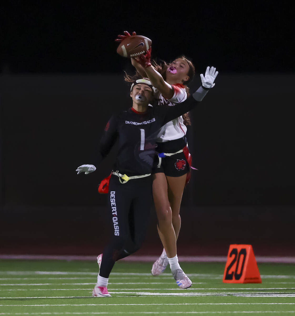 Desert Oasis' Kaydence Gerstel-Richardson (1) breaks up a pass intended for Las Vegas&#x20 ...