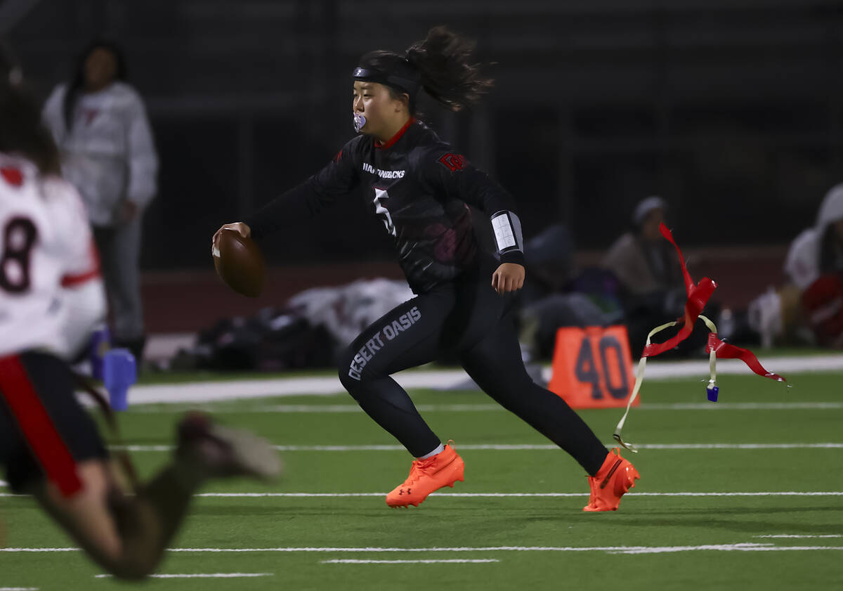 Desert Oasis' Akemi Higa (5) gets her flags pulled by Las Vegas during a flag football gam ...