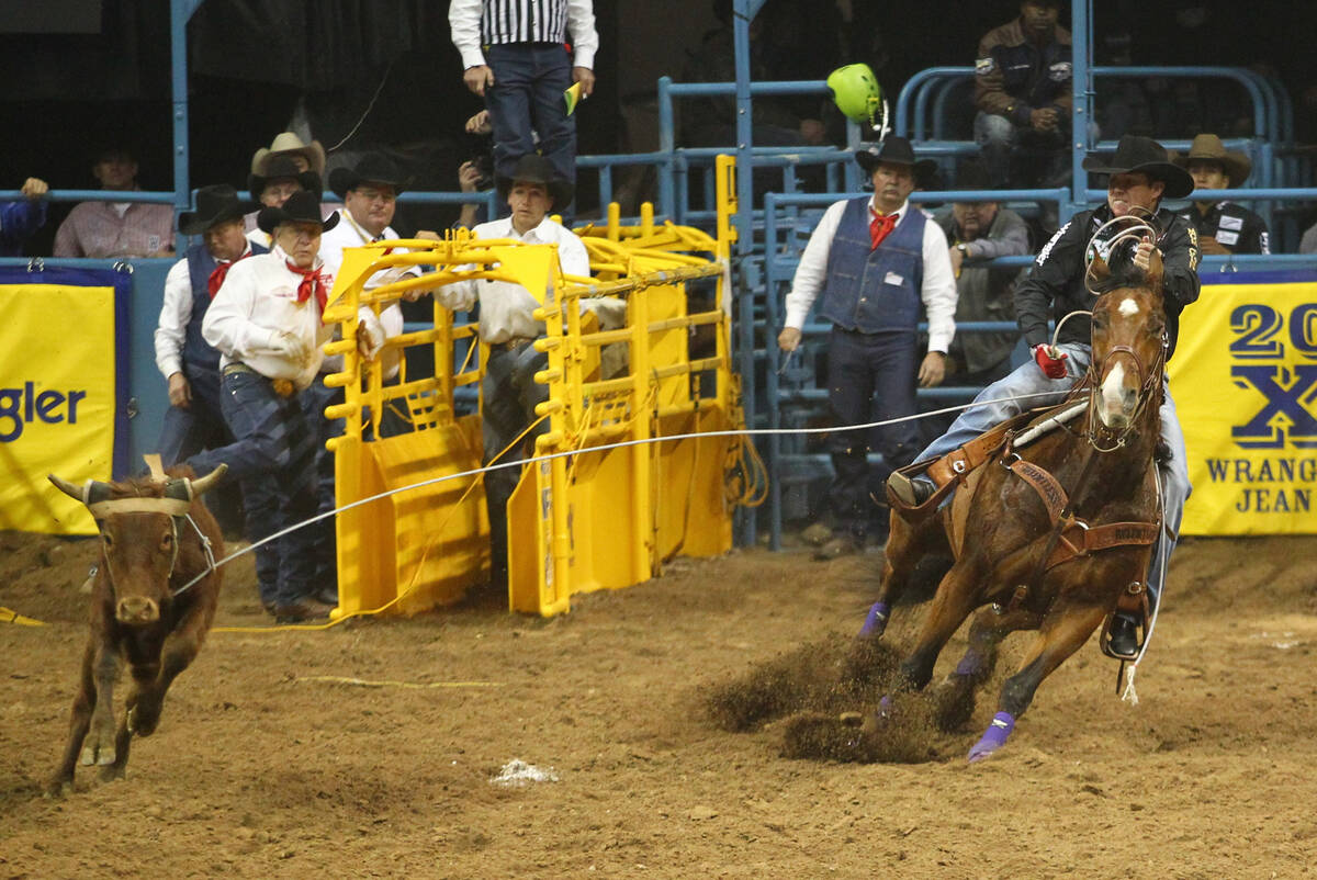 Trevor Brazile of Decatur, Texas ropes in the head of a steer during the Team Roping competitio ...
