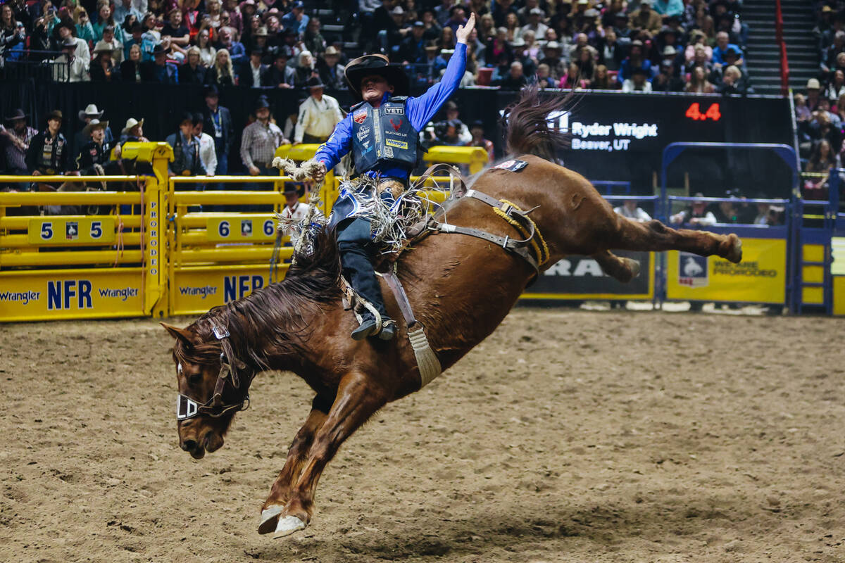 Ryder Wright rides during the saddle bronc portion of the National Finals Rodeo at the Thomas & ...