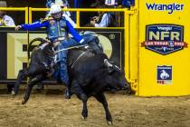 Stetson Wright of Milford, UT., completes another winning ride during Bull Riding in the Nation ...