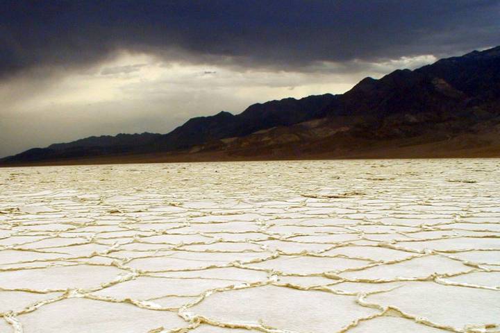 Storm clouds build over Badwater Basin in this undated photo from Death Valley National Park in ...