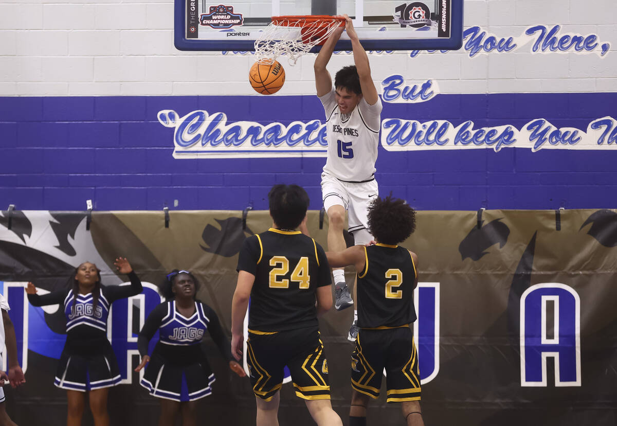 Desert Pines wing Tyler Merto (15) dunks the ball against Clark during the second half of a bas ...