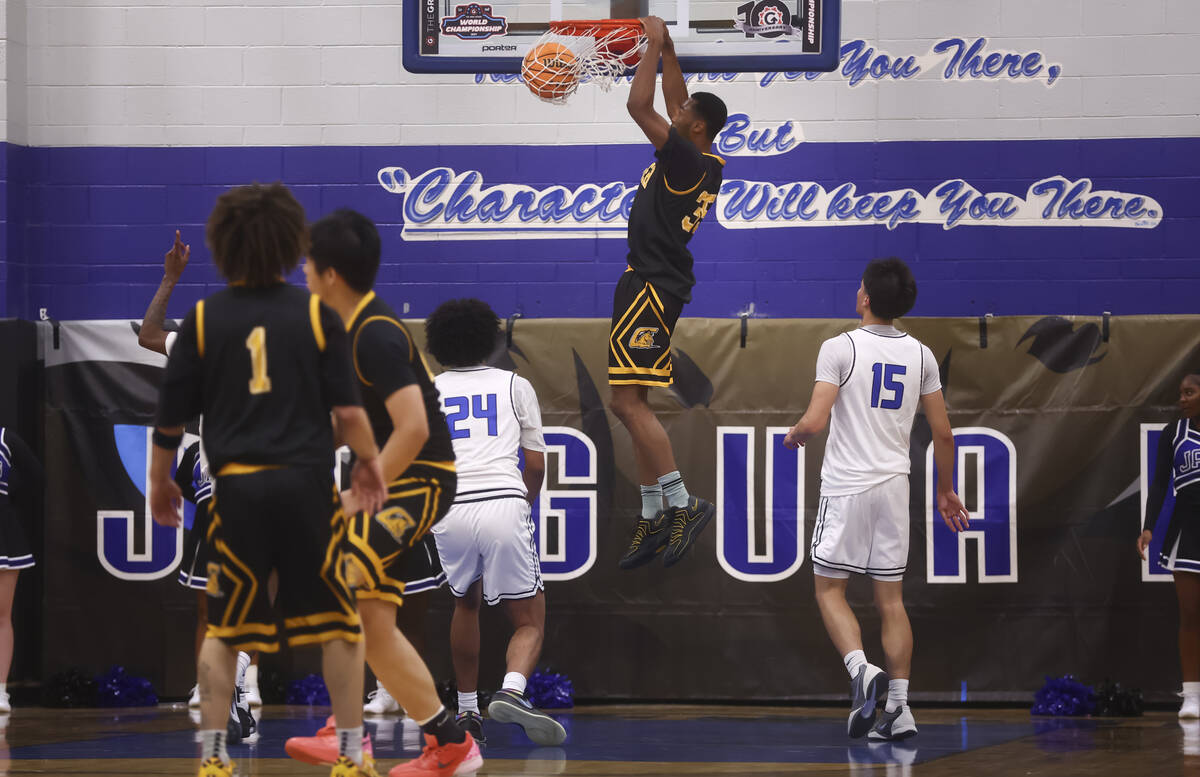 Clark small forward/power forward Devan Christion (35) dunks the ball against Desert Pines duri ...