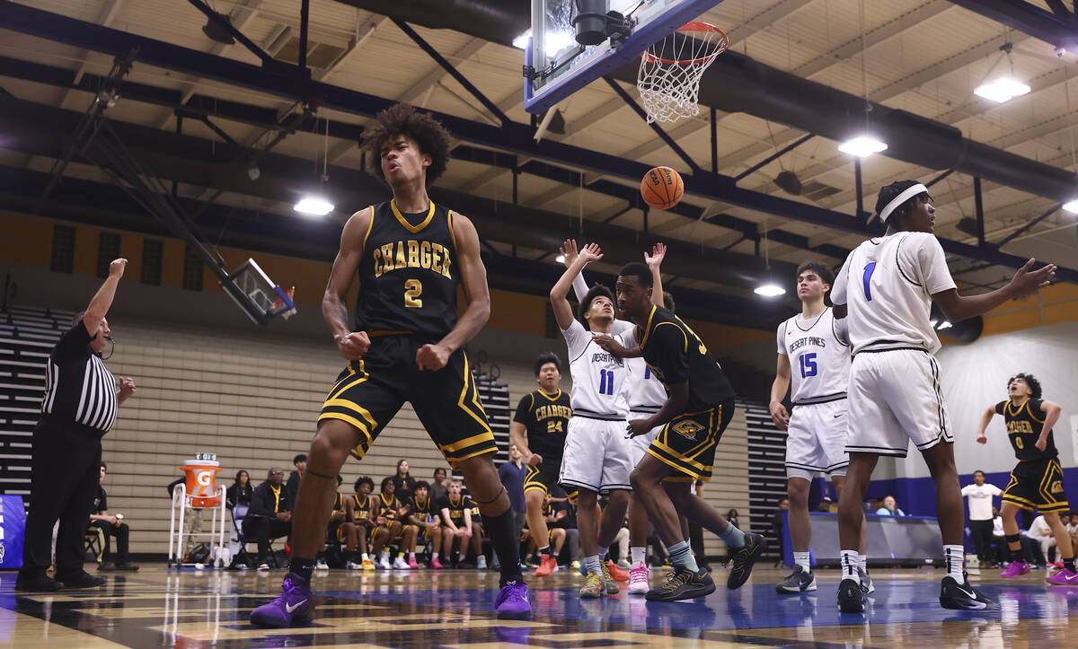 Clark point guard/shooting guard Sir Montgomery (2) celebrates scoring and drawing a foul on De ...