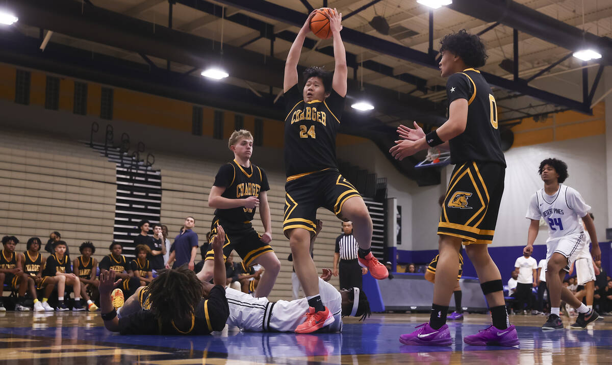 Clark forward Andrew Yeung (24) grabs a rebound against Desert Pines during the first half of a ...