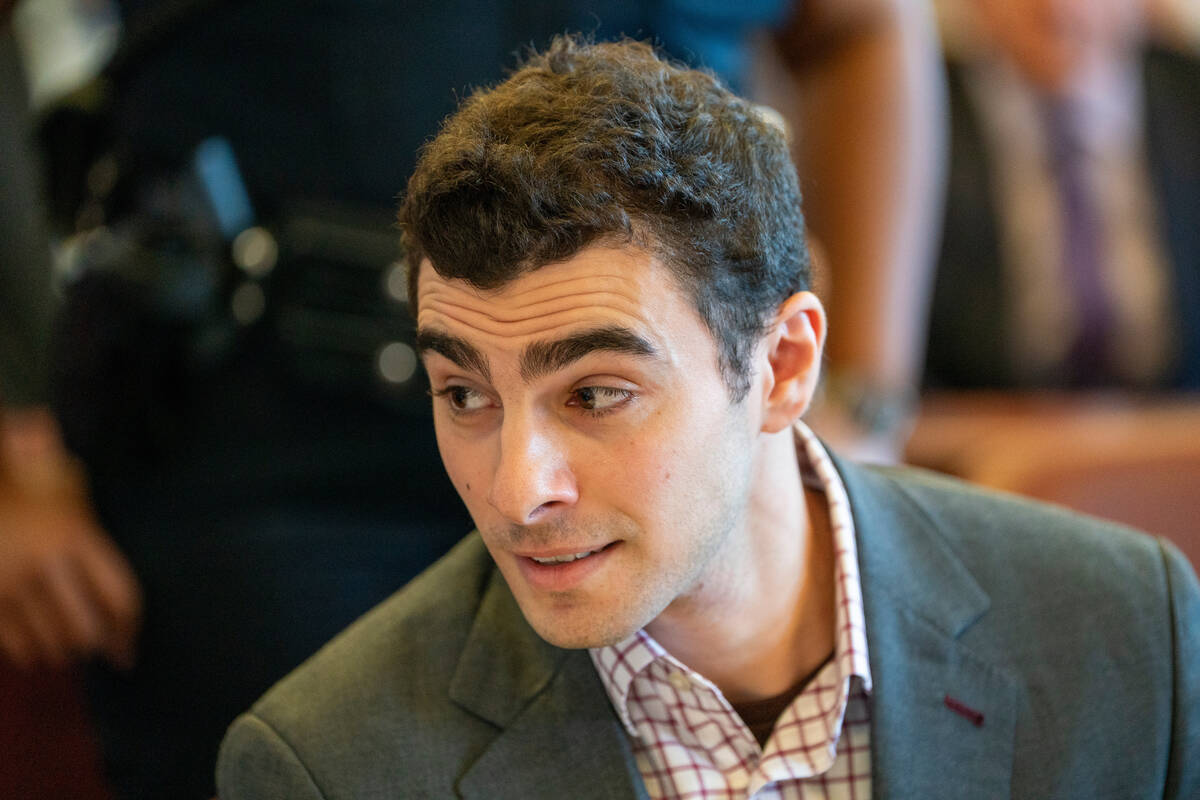 Luigi Mangione, center, appears in court for an evidence hearing, Monday, Dec. 1, 2025, in New ...