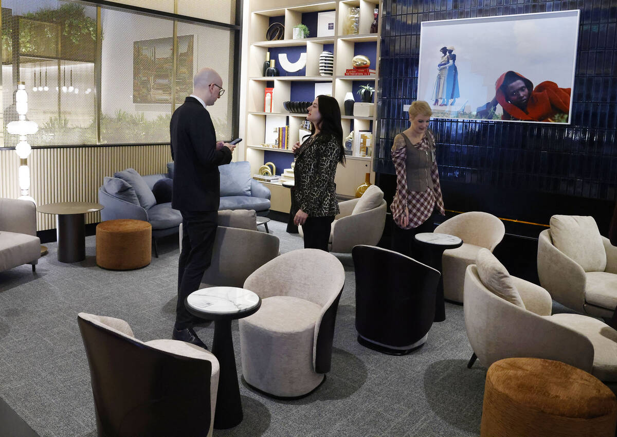 Guests interact at the newly opened Chase Sapphire-branded airport lounge at Harry Reid Interna ...
