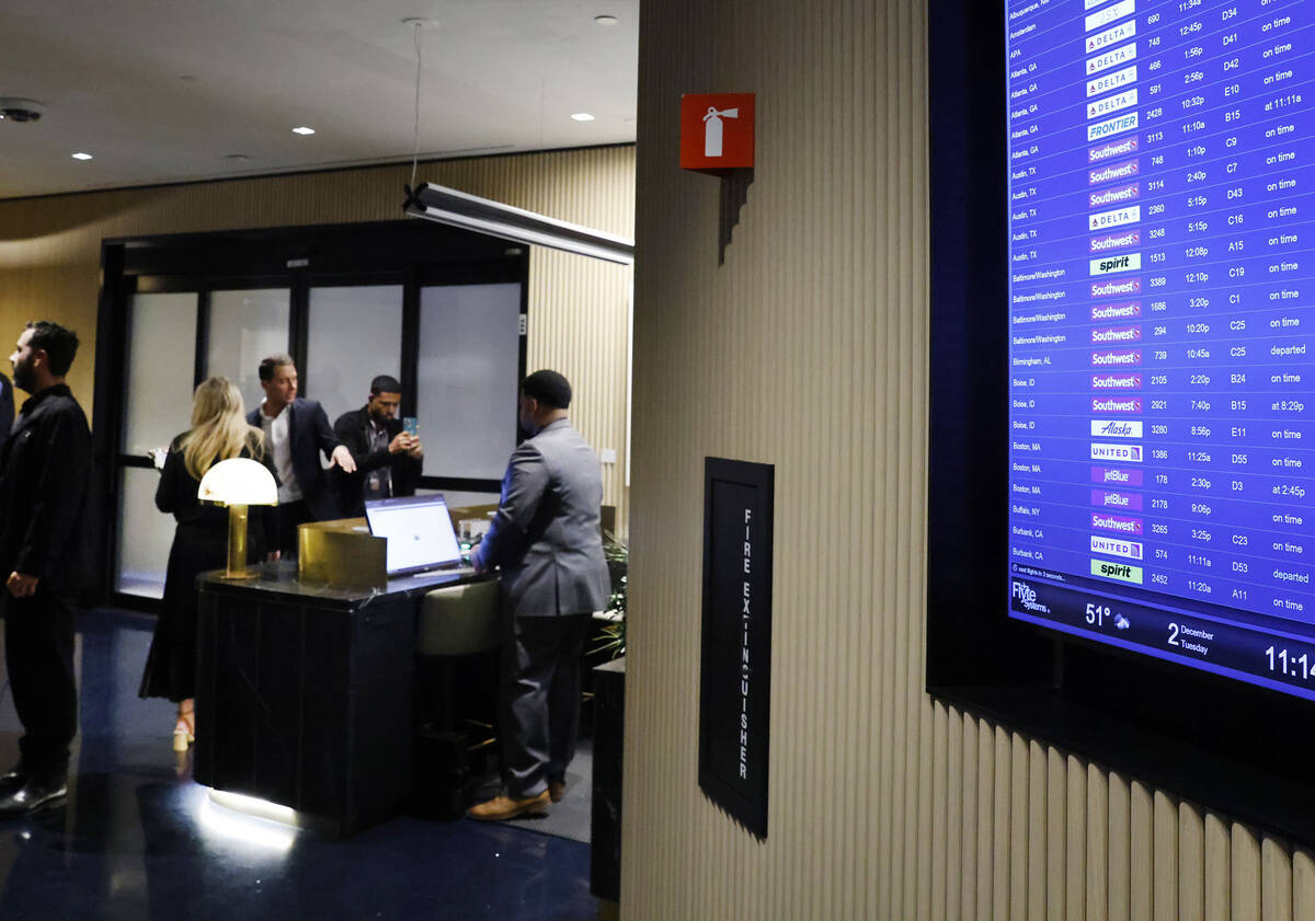 Flights information are displayed at the newly opened Chase Sapphire-branded airport lounge at ...