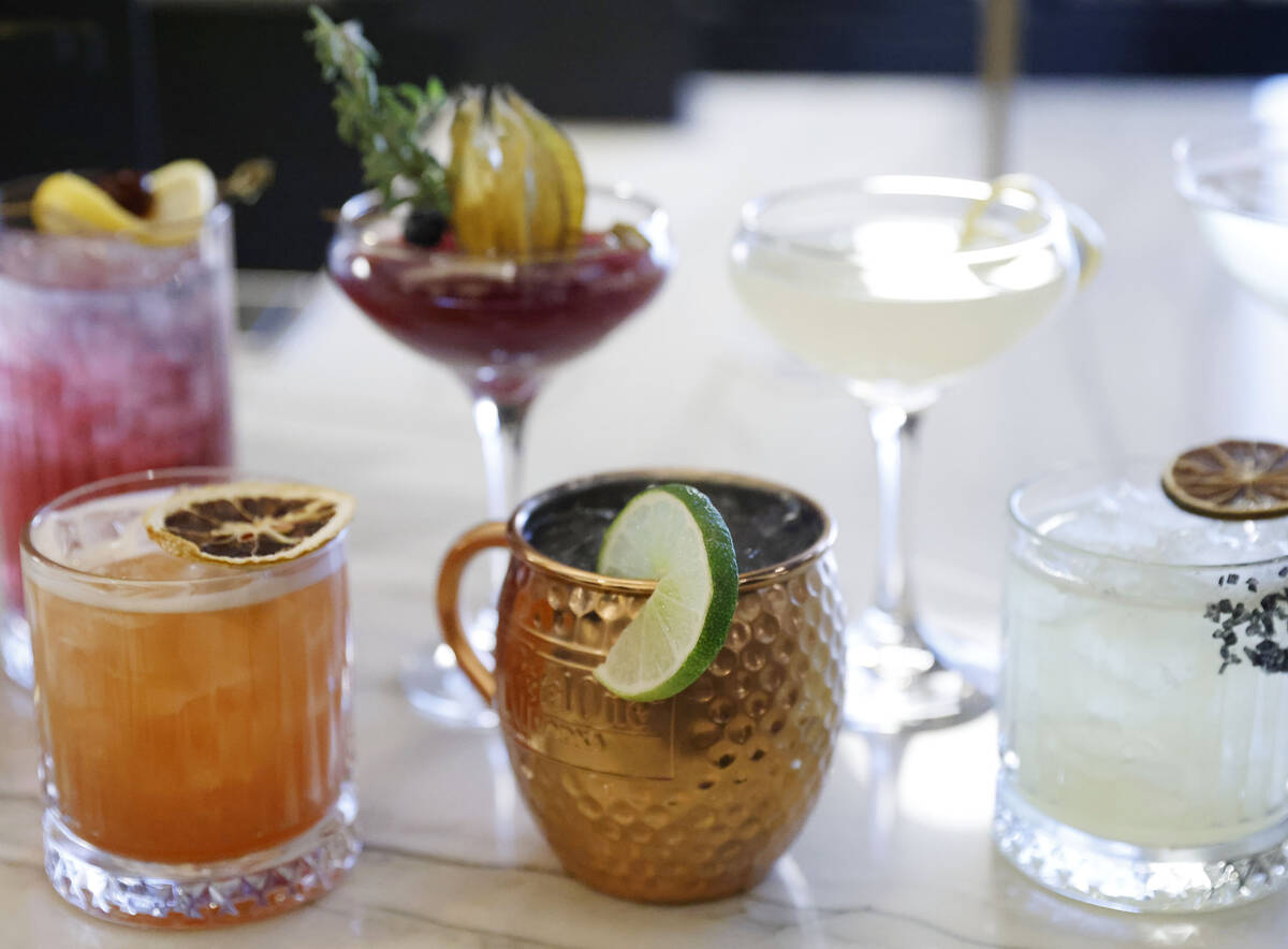 Cocktail drinks are seen at the newly opened Chase Sapphire-branded airport lounge at Harry Rei ...