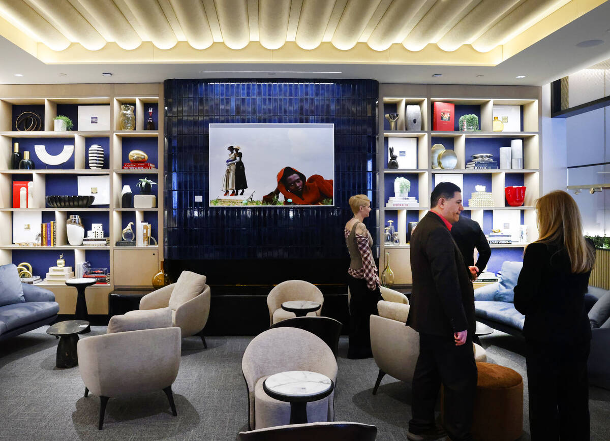 Guests interact at the newly opened Chase Sapphire-branded airport lounge at Harry Reid Interna ...
